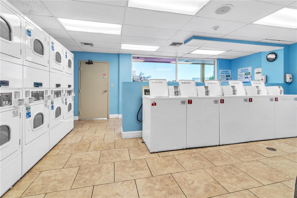 Undisclosed Address Tampa, FL 33607 - Photo 34 of 40 a view of a kitchen with cabinets and washer