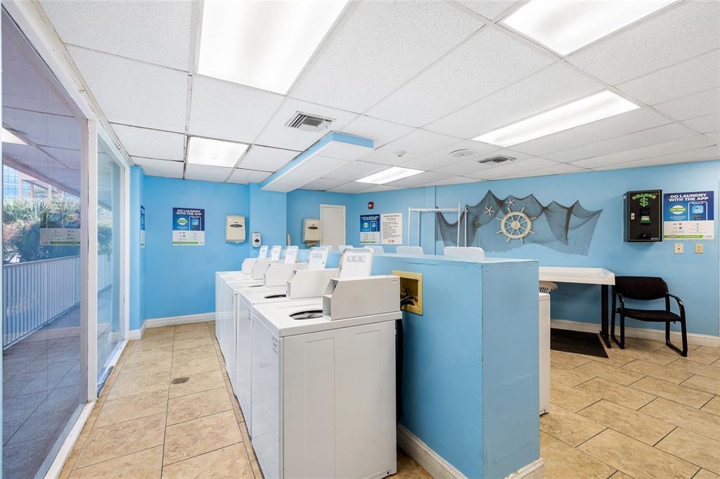 Undisclosed Address Tampa, FL 33607 - Photo 39 of 40 a living room with a couch and a dining table