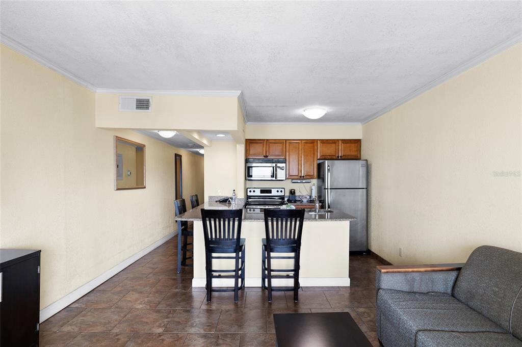 Undisclosed Address Tampa, FL 33607 - Photo 10 of 40 a living room with furniture and wooden floor