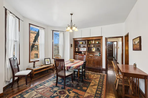a view of a dining room with furniture window and wooden floor