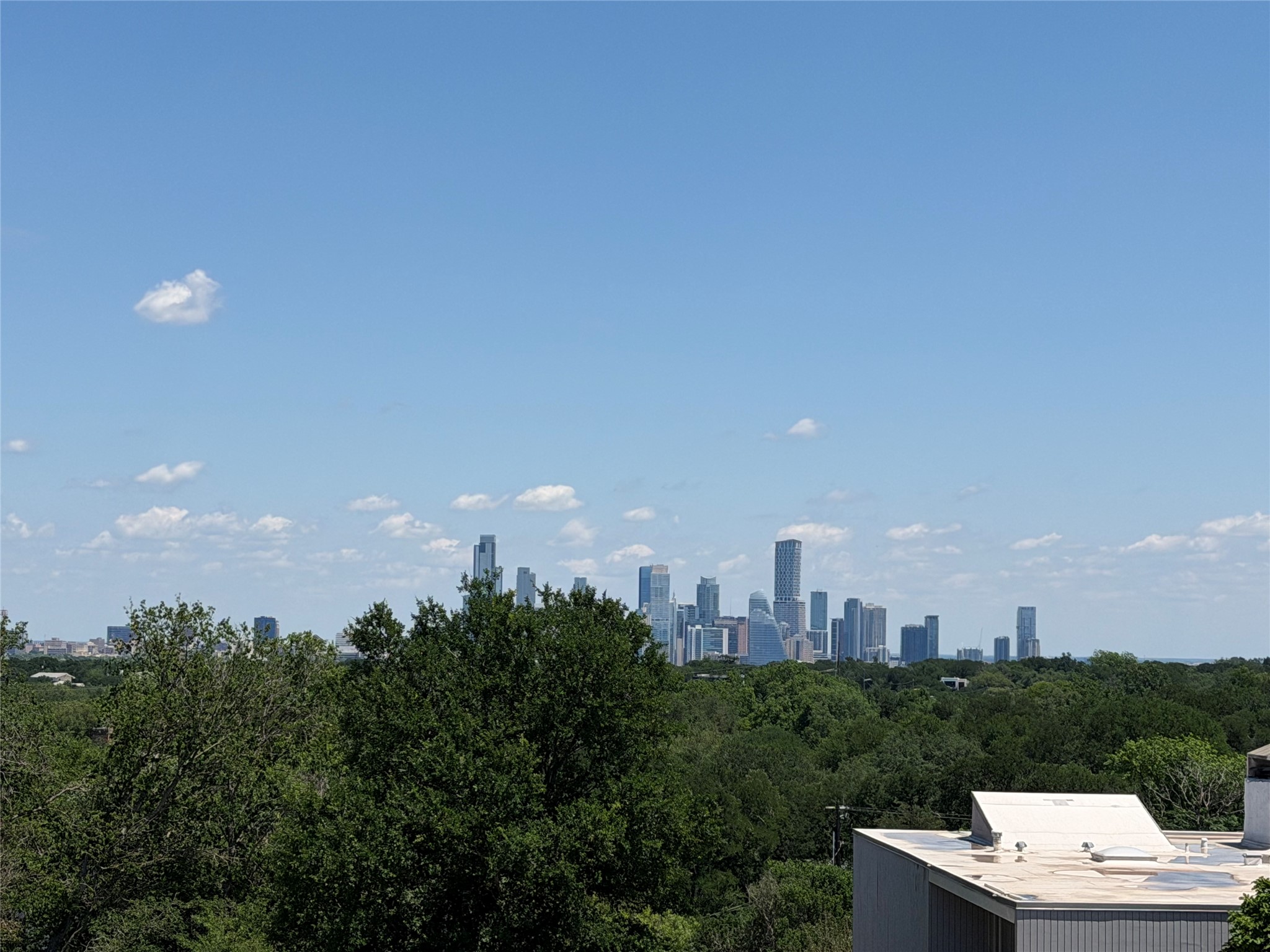 604 Brookhaven Trail Austin, TX 78746 - Photo 37 of 38 Austin Skyline view from the upper level terrace.