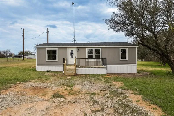 a house view with a backyard space