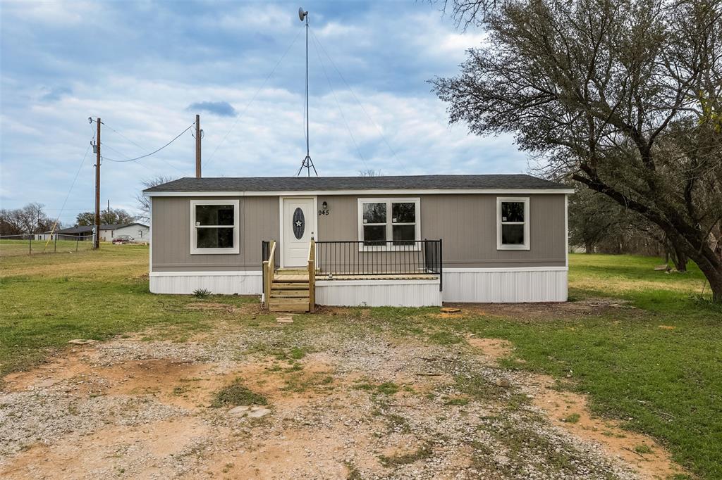945 Walnut Street Azle, TX 76020 - Photo 1 of 29 a house view with a backyard space