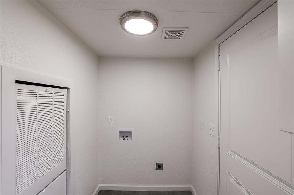 945 Walnut Street Azle, TX 76020 - Photo 22 of 29 a view of small space with racks on the wall