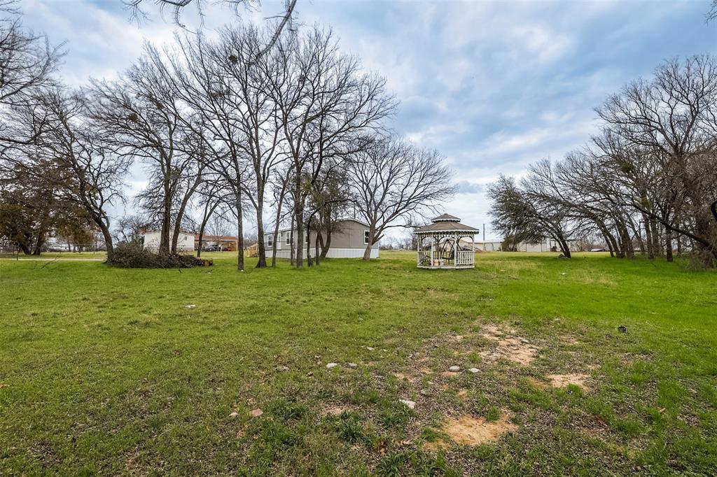 945 Walnut Street Azle, TX 76020 - Photo 23 of 29 a view of yard with trees