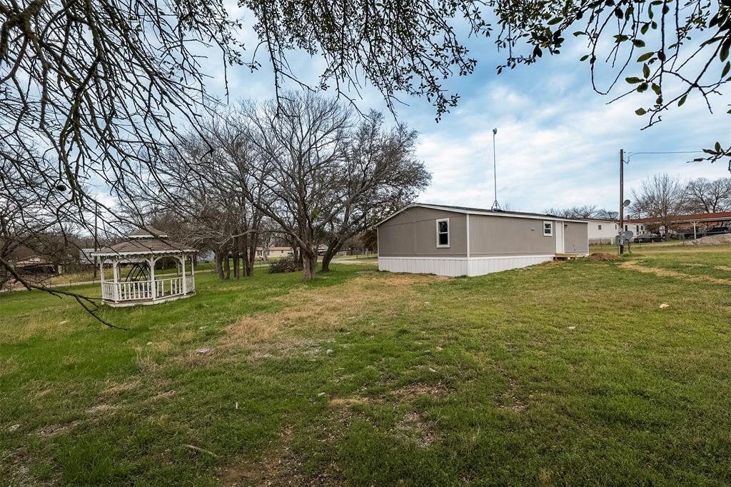 945 Walnut Street Azle, TX 76020 - Photo 24 of 29 a big room with river and trees