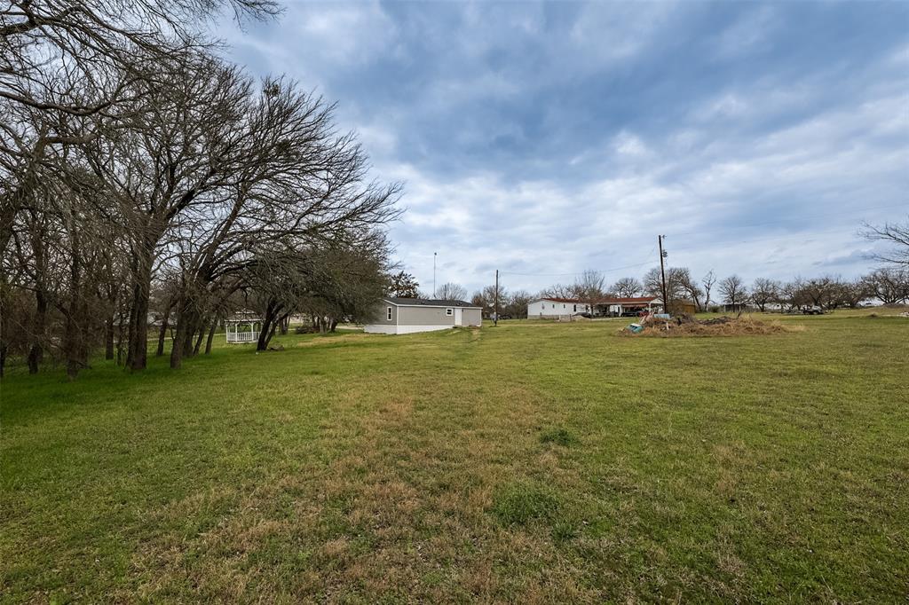 945 Walnut Street Azle, TX 76020 - Photo 27 of 29 a view of outdoor space with green field