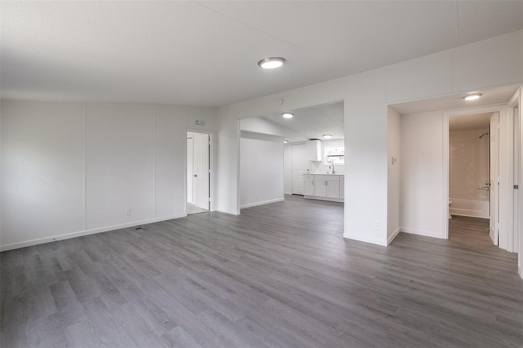 945 Walnut Street Azle, TX 76020 - Photo 9 of 29 a view of empty room with wooden floor