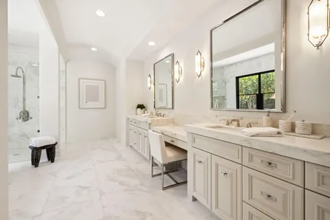 a bathroom with a sink a toilet and vanity