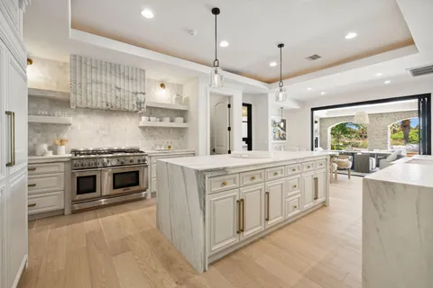 a view of a kitchen center island and living room