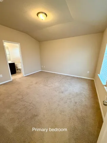 a bathroom with a sink a toilet a mirror and shower