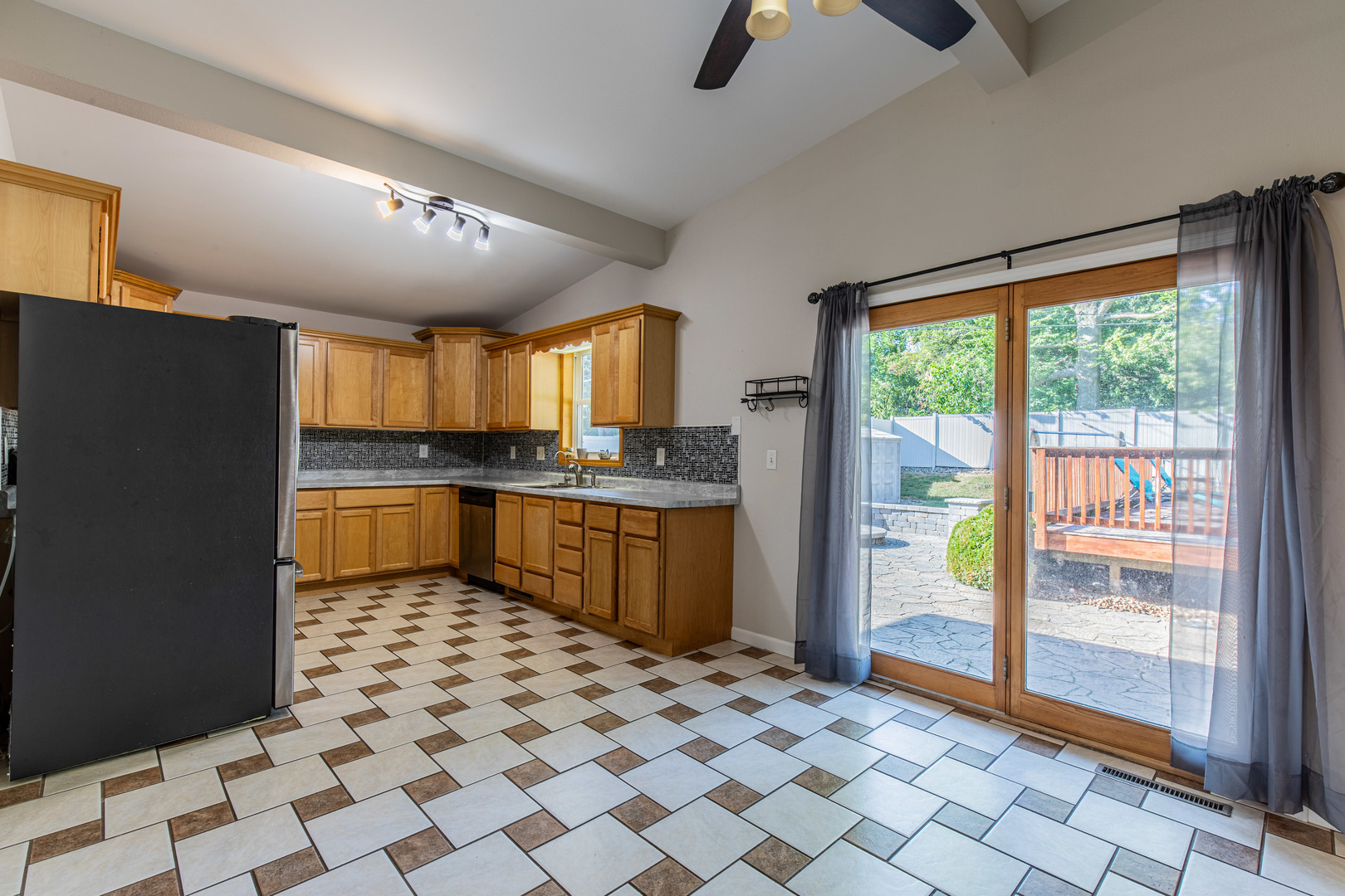1106 Beech Drive Dixon, IL 61021 - Photo 6 of 32 a kitchen with granite countertop a refrigerator a sink and white cabinets