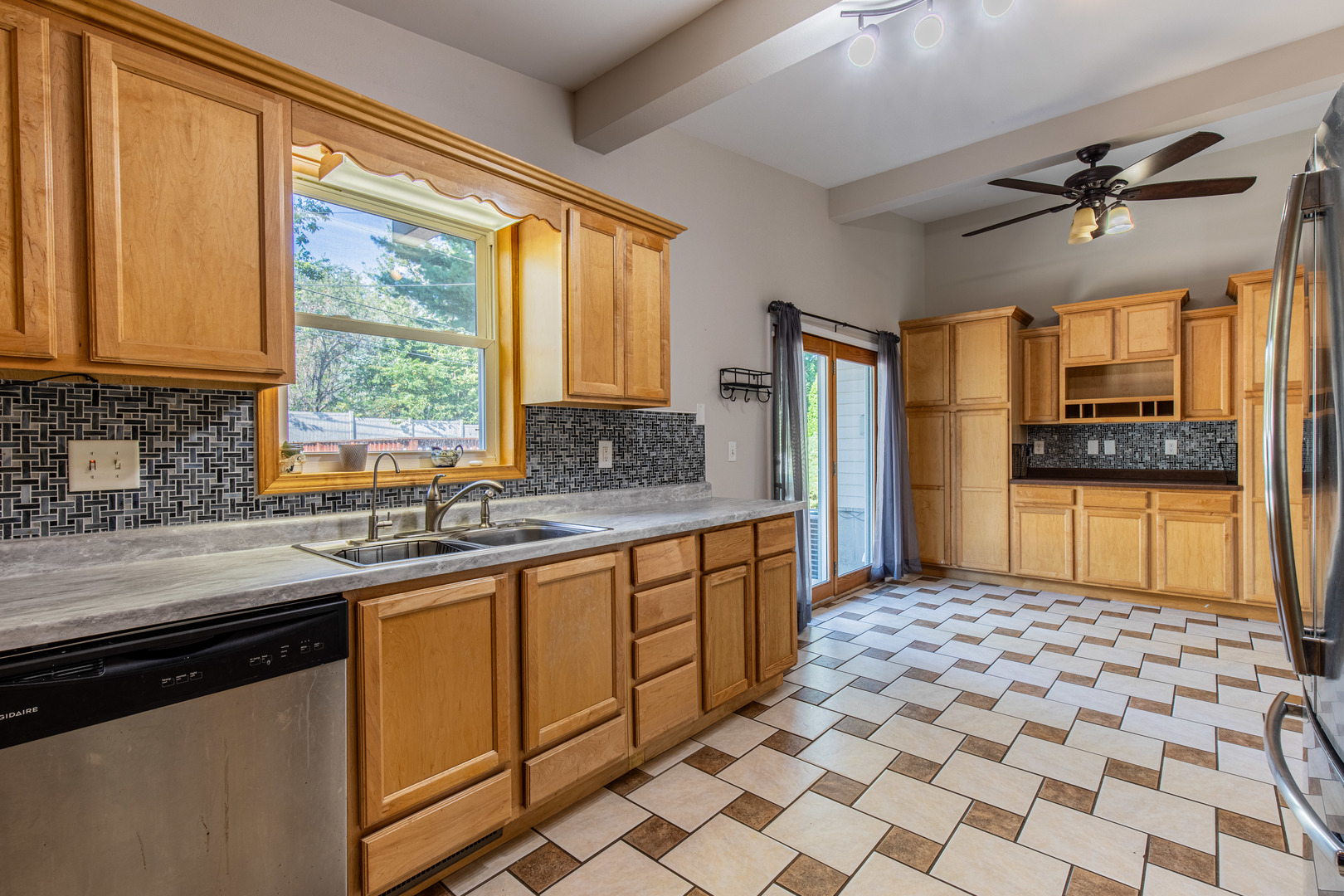 1106 Beech Drive Dixon, IL 61021 - Photo 10 of 32 a kitchen with stainless steel appliances wooden cabinets a sink and a stove