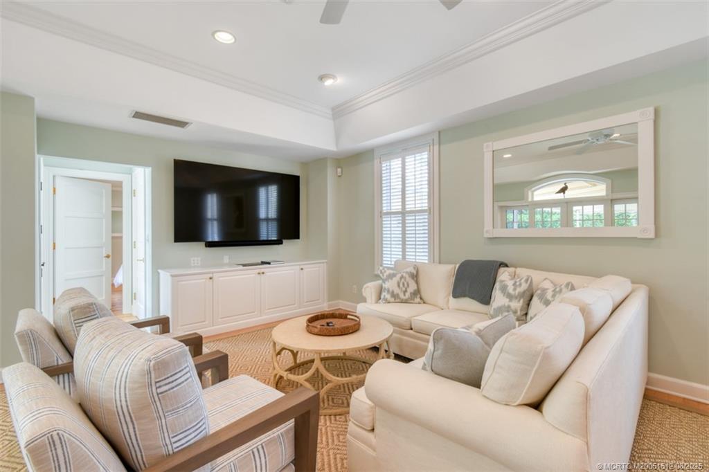 485 South Beach Road Hobe Sound, FL 33455 - Photo 13 of 72 a living room with furniture and a flat screen tv