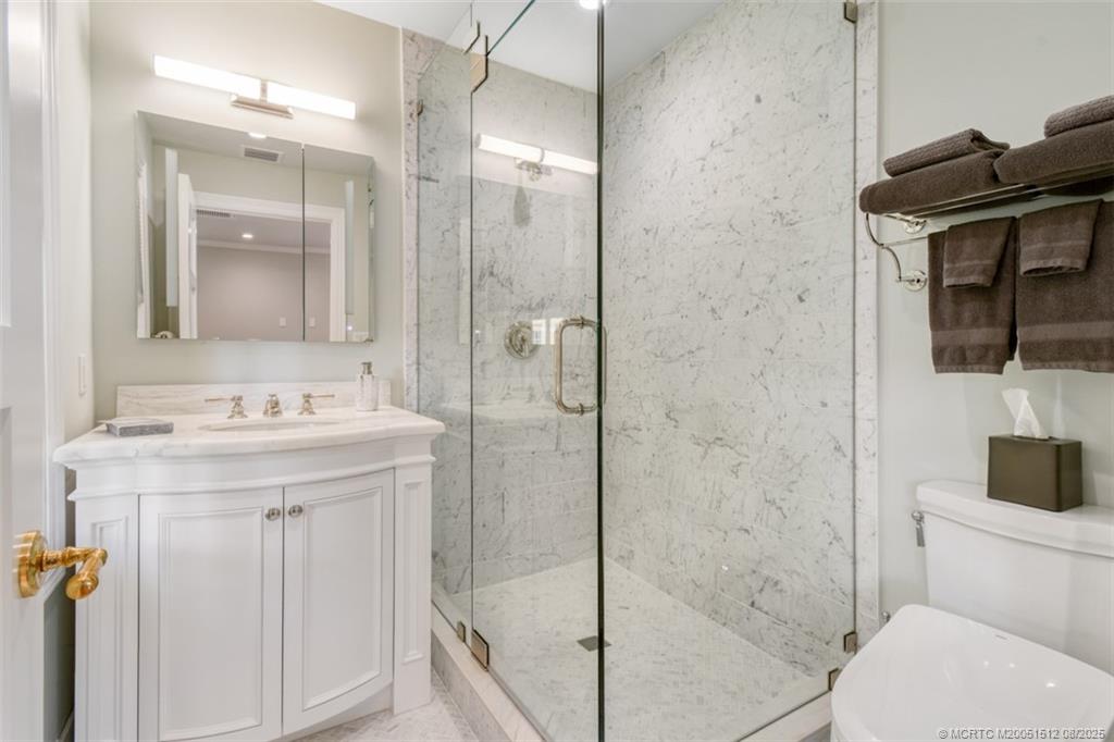 485 South Beach Road Hobe Sound, FL 33455 - Photo 20 of 72 a bathroom with a sink a toilet and shower