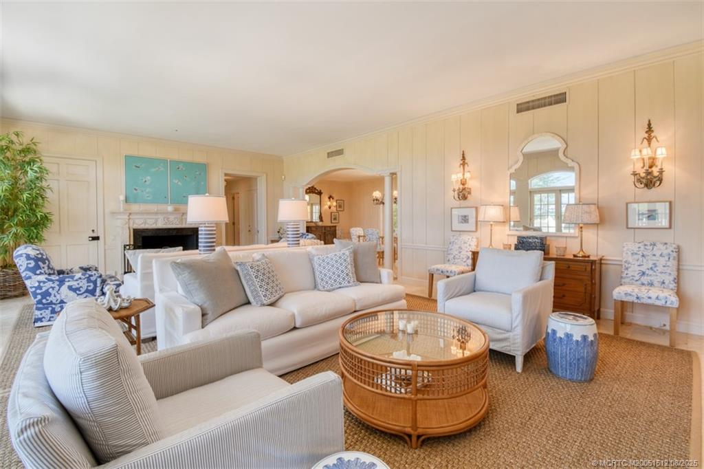 485 South Beach Road Hobe Sound, FL 33455 - Photo 23 of 72 a living room with furniture and a fireplace