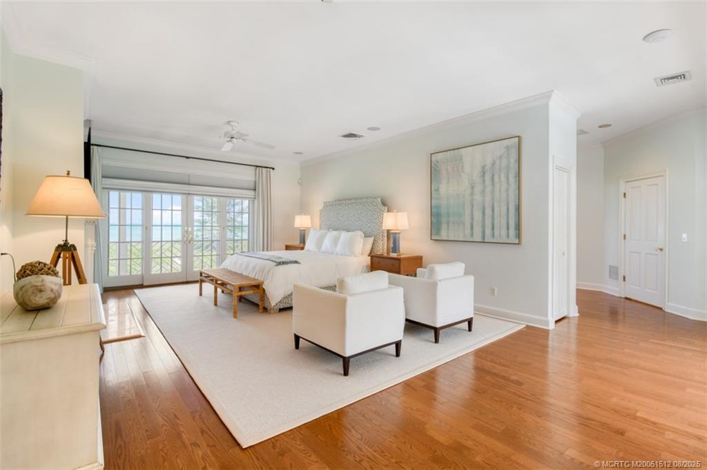 485 South Beach Road Hobe Sound, FL 33455 - Photo 41 of 72 a bed room with a bed and a large window