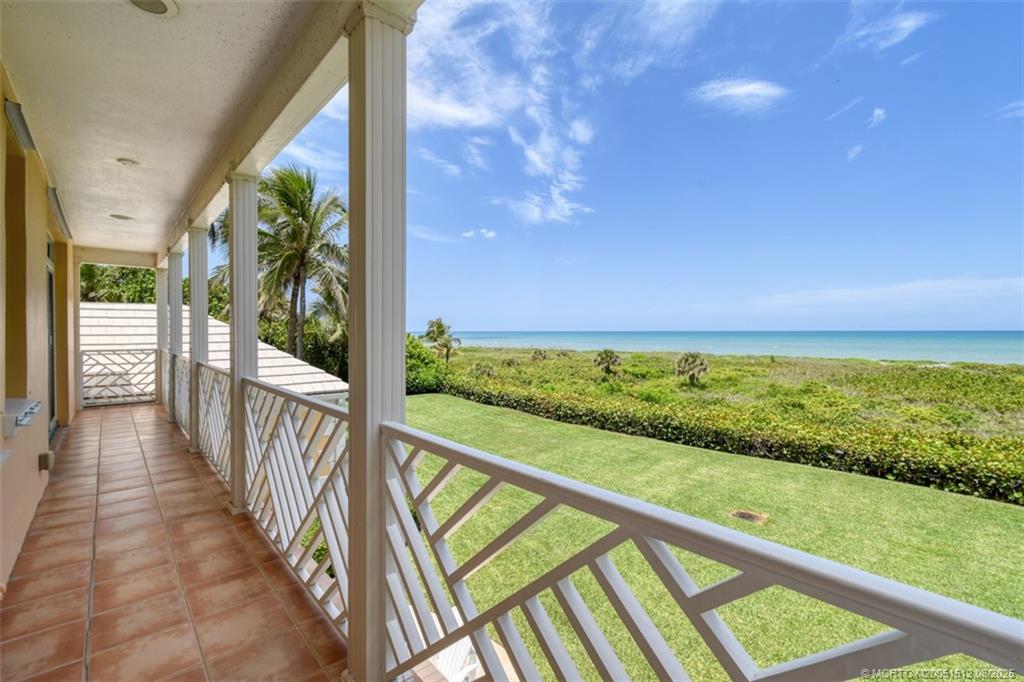 485 South Beach Road Hobe Sound, FL 33455 - Photo 45 of 72 a view of balcony with wooden floor and fence