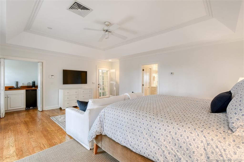 485 South Beach Road Hobe Sound, FL 33455 - Photo 55 of 72 a bedroom with a bed and a flat screen tv