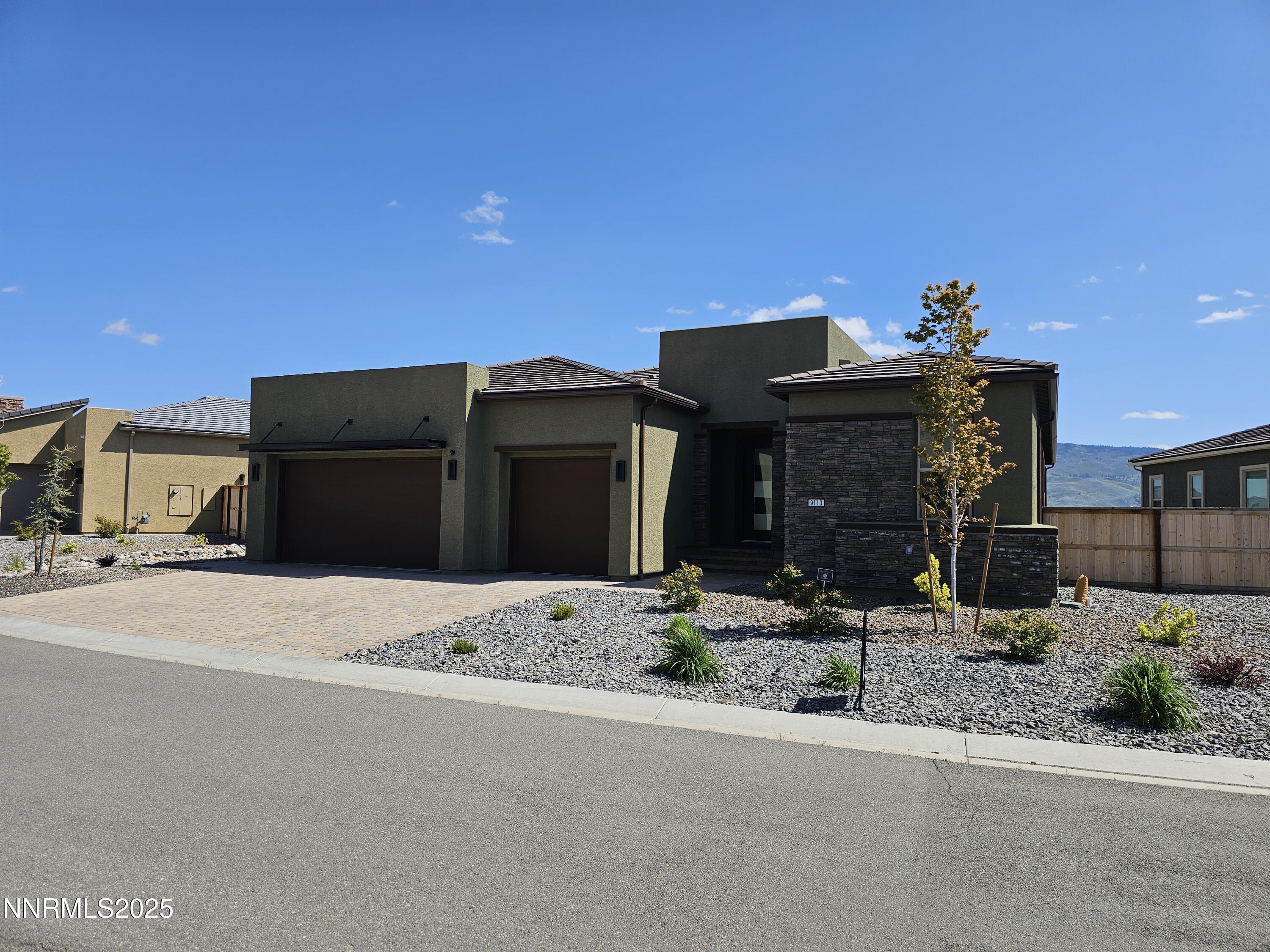 a front view of a house with a outdoor space