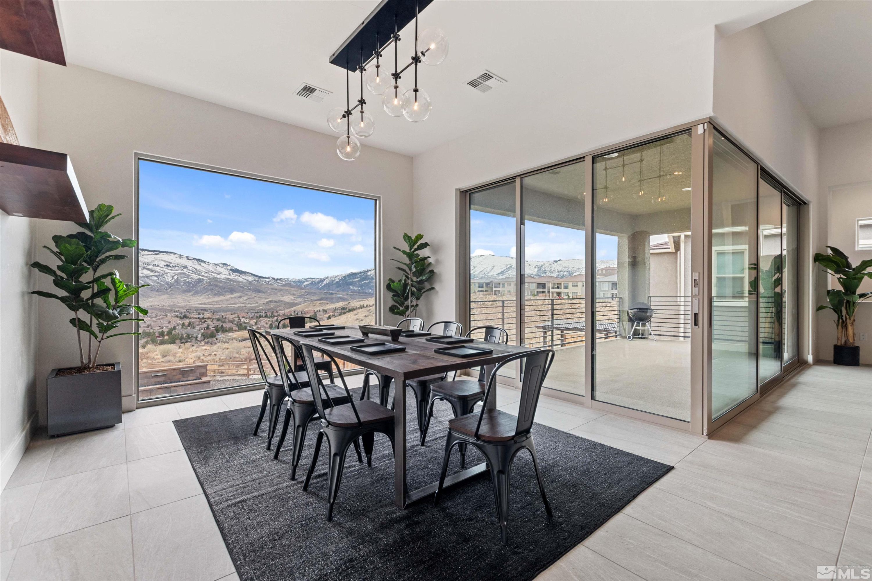 9110 Wild Skies Way Reno, NV 89523 - Photo 16 of 46 a view of a dining room with furniture window and outside view