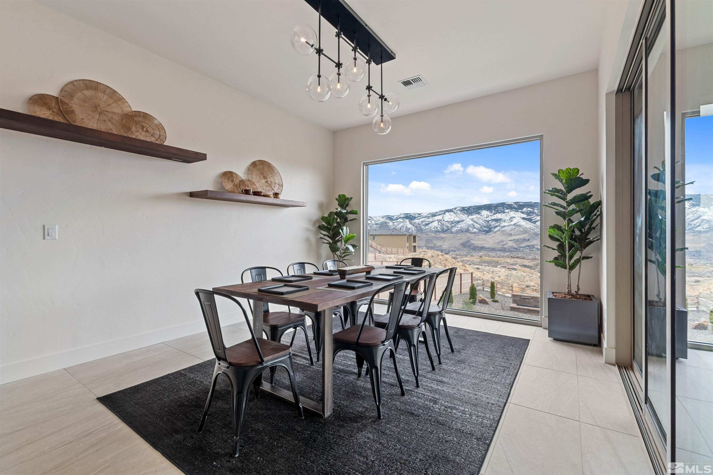 9110 Wild Skies Way Reno, NV 89523 - Photo 23 of 46 a view of a dining room with furniture window and outside view