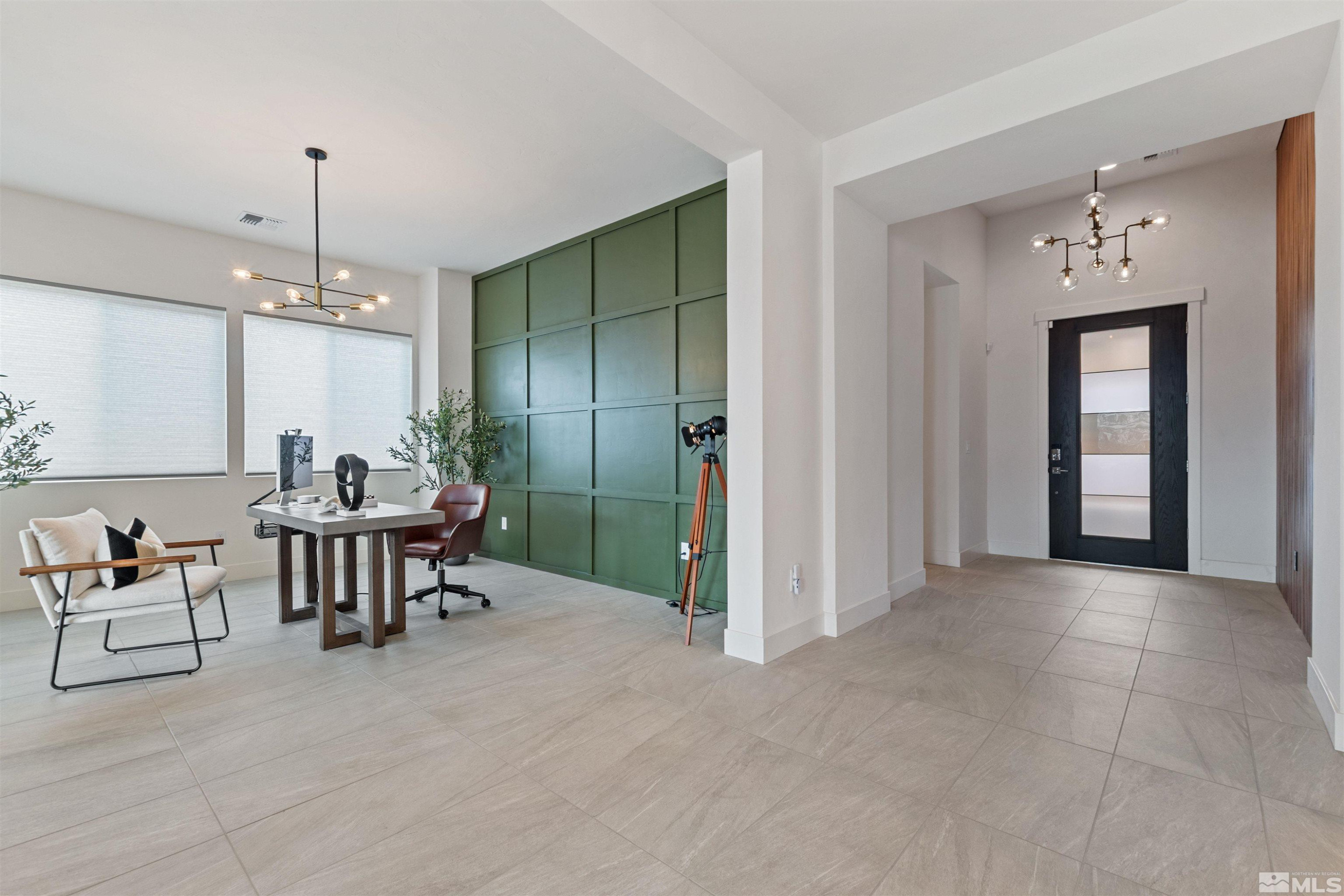 9110 Wild Skies Way Reno, NV 89523 - Photo 24 of 46 a view of a livingroom with furniture chandelier and windows
