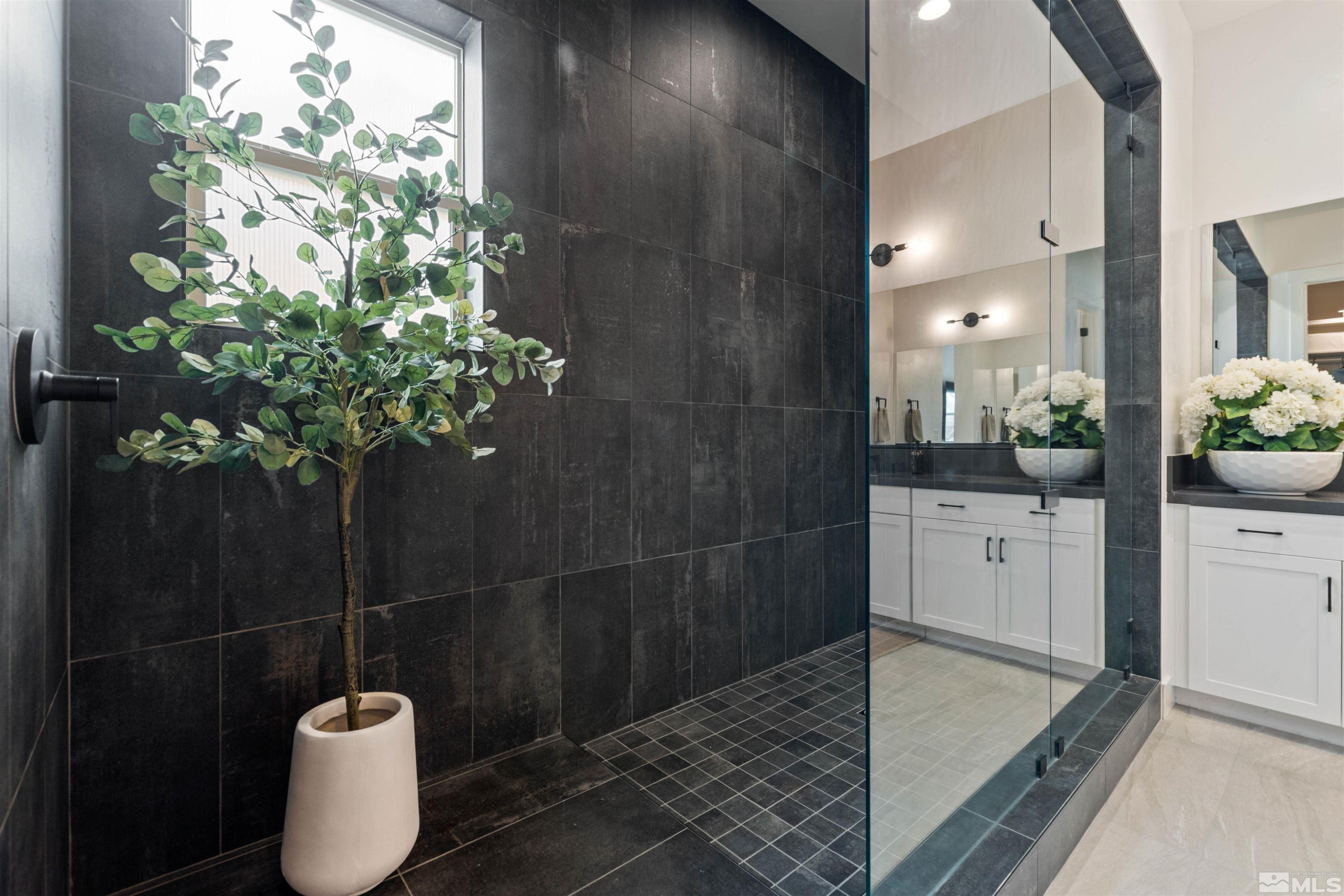 9110 Wild Skies Way Reno, NV 89523 - Photo 27 of 46 a bathroom with a sink and mirror