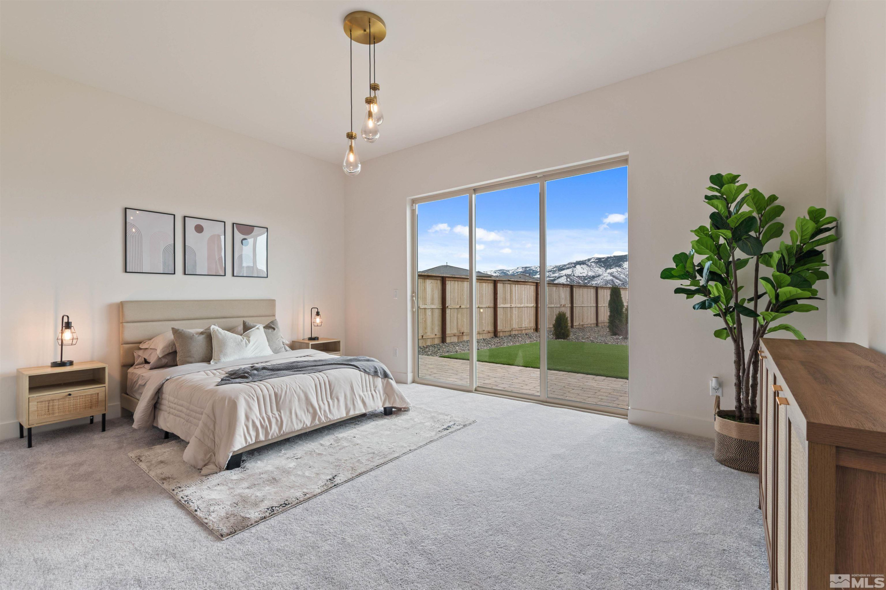 9110 Wild Skies Way Reno, NV 89523 - Photo 29 of 46 a spacious bedroom with a bed and a potted plant