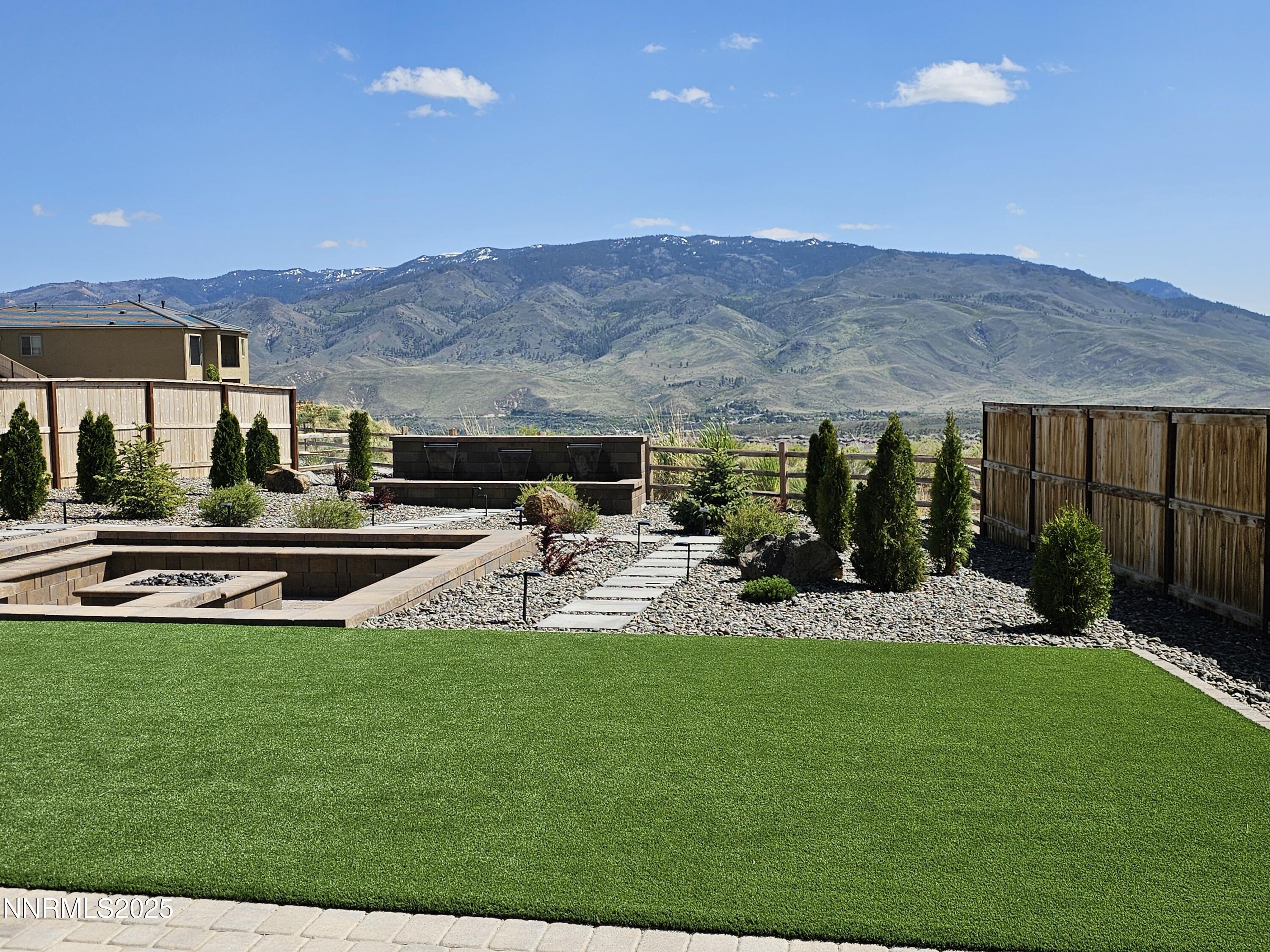 9110 Wild Skies Way Reno, NV 89523 - Photo 3 of 46 a view of a house with backyard and sitting area
