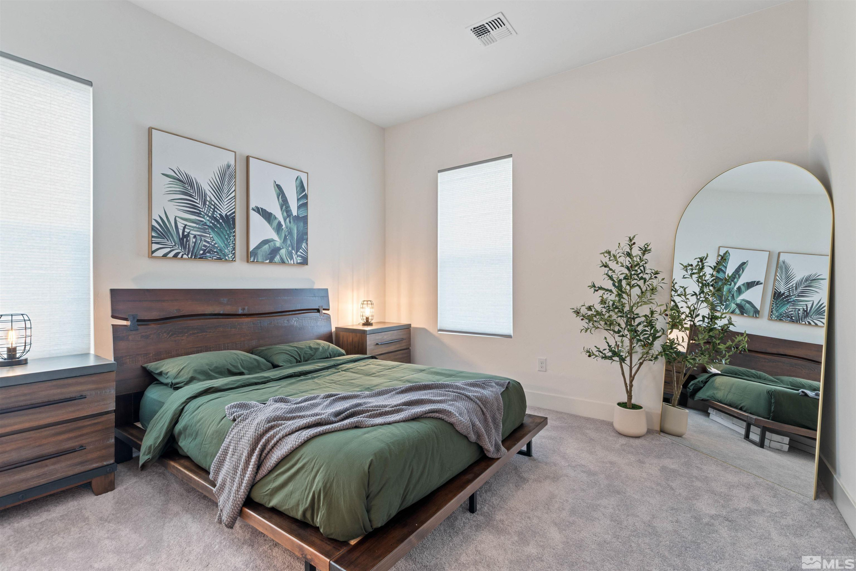 9110 Wild Skies Way Reno, NV 89523 - Photo 31 of 46 a bedroom with a bed and a potted plant