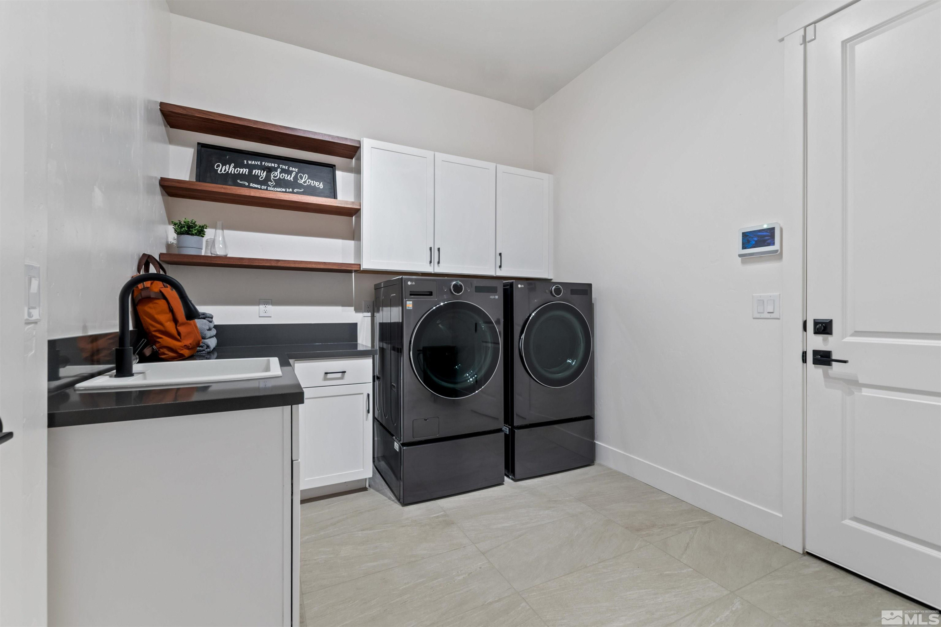 9110 Wild Skies Way Reno, NV 89523 - Photo 37 of 46 a utility room with dryer and washer