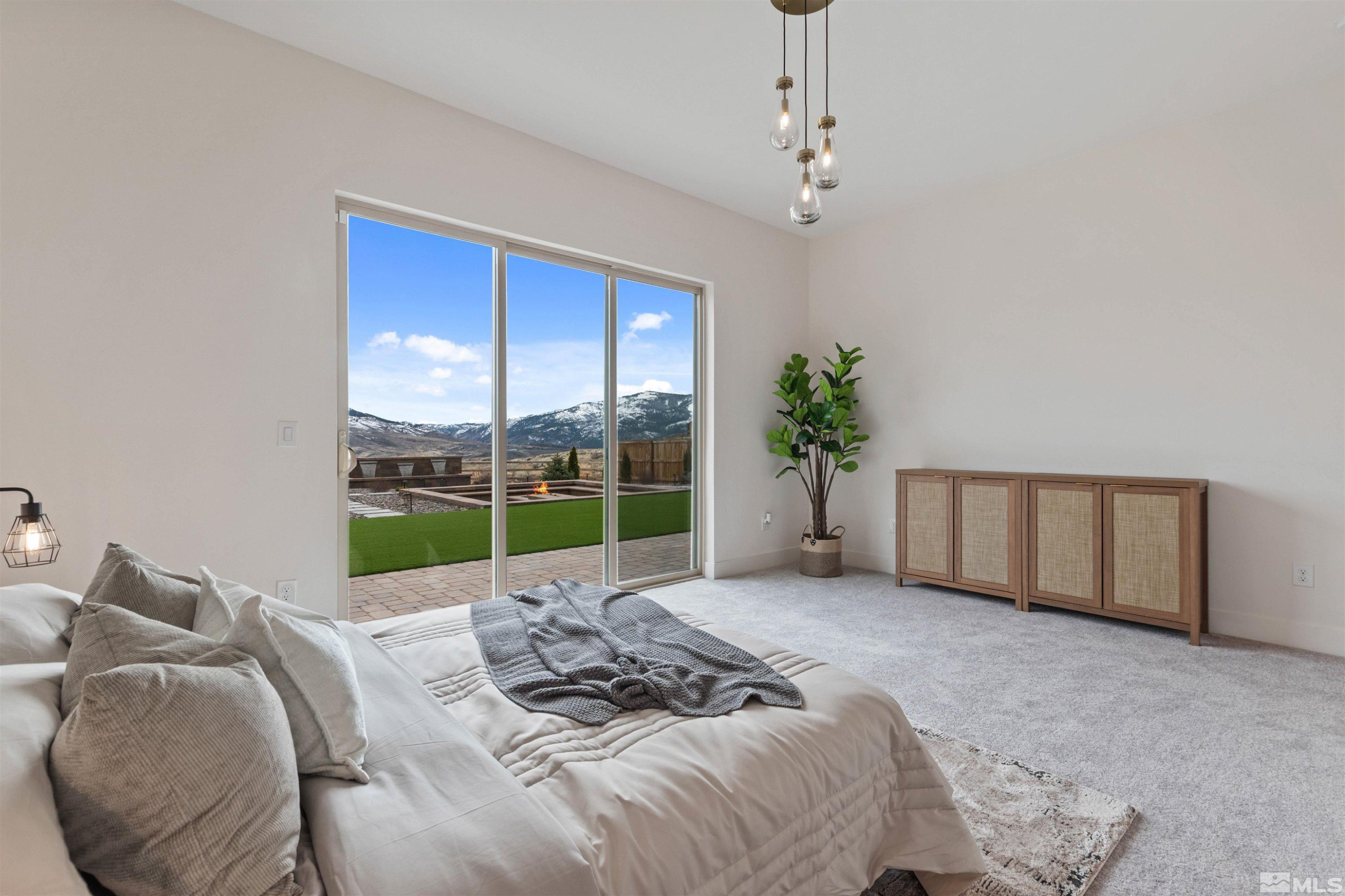 9110 Wild Skies Way Reno, NV 89523 - Photo 41 of 46 a bed sitting in a bedroom next to a window
