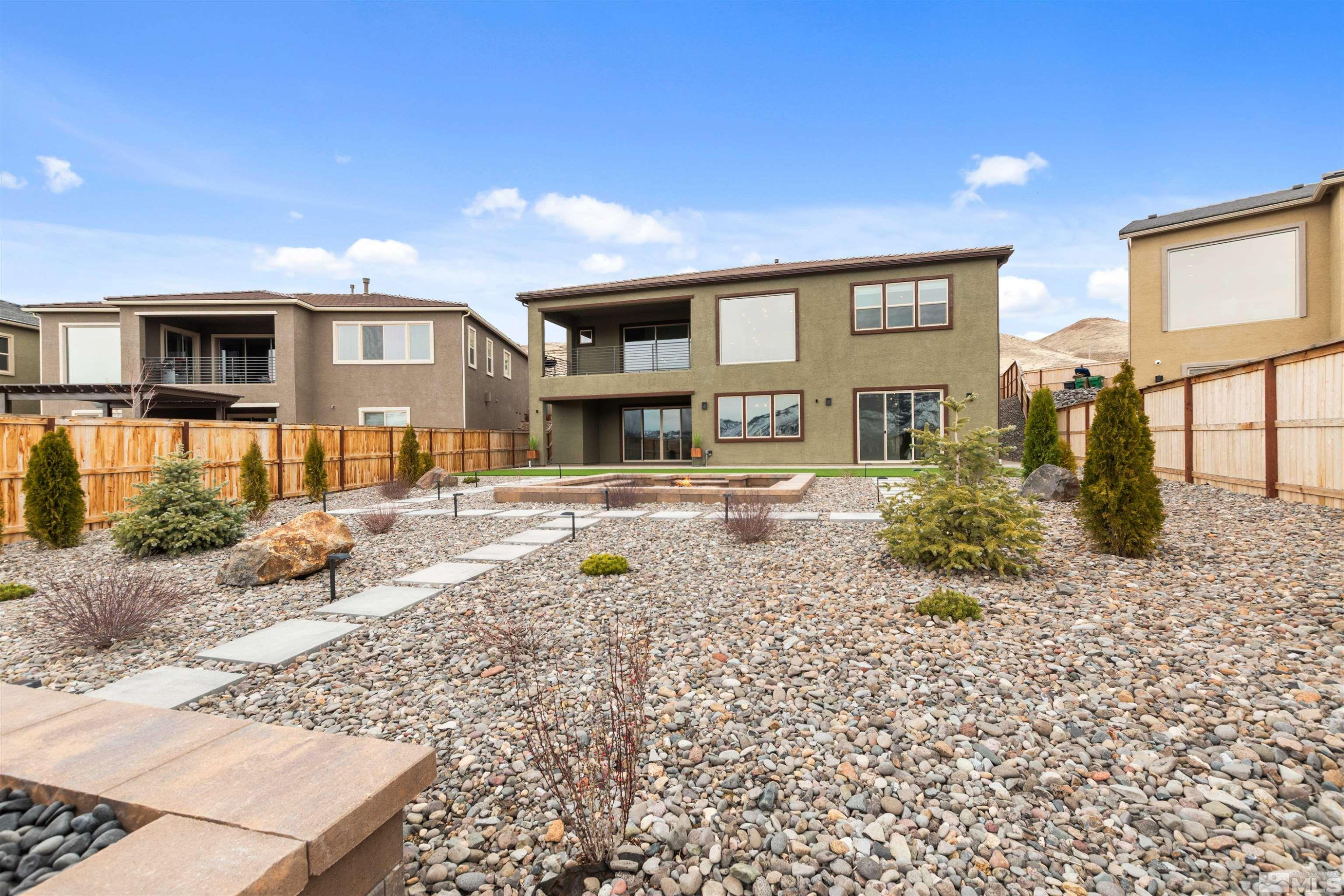 9110 Wild Skies Way Reno, NV 89523 - Photo 43 of 46 a front view of a house with a yard