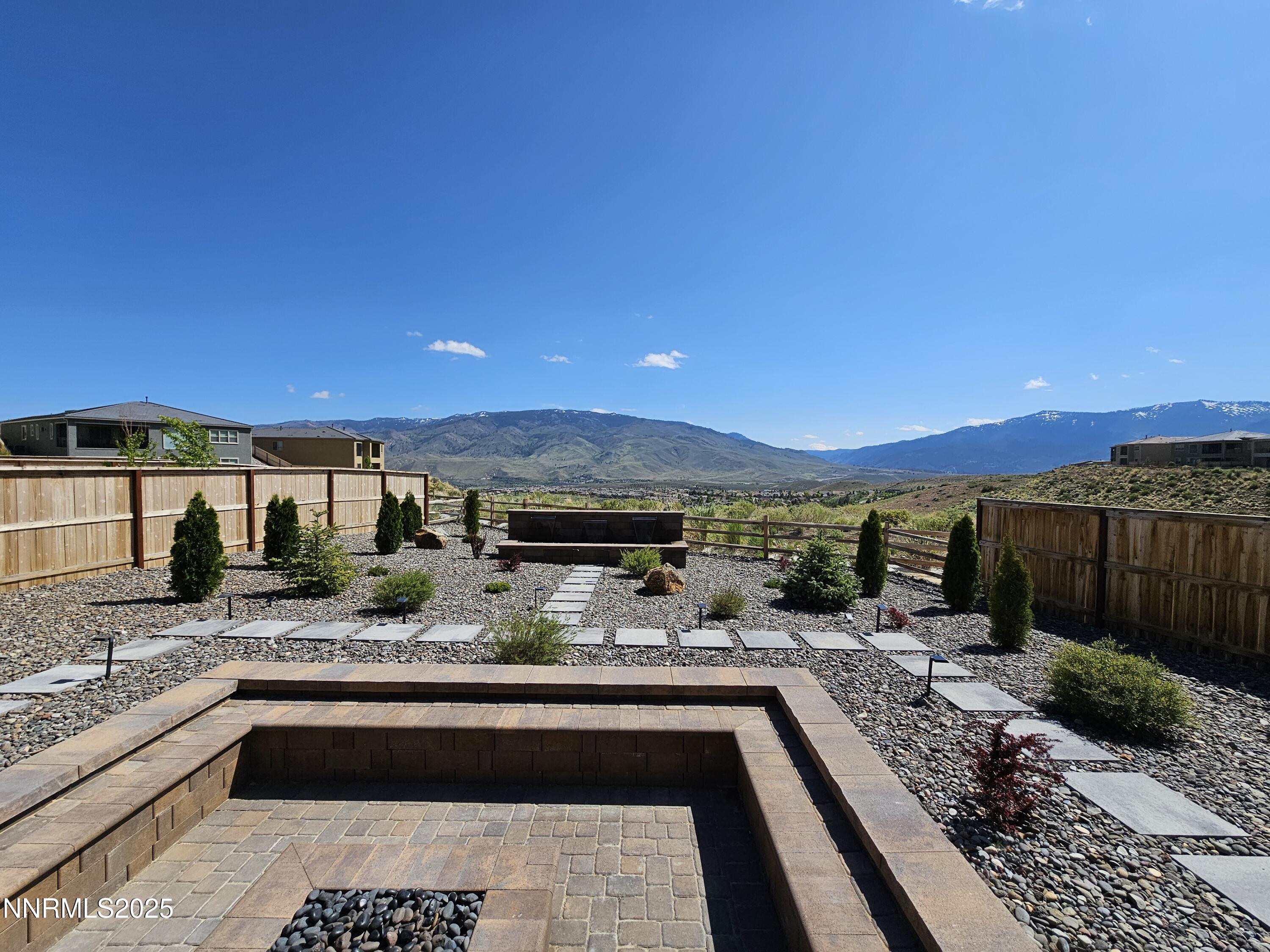 9110 Wild Skies Way Reno, NV 89523 - Photo 8 of 46 a view of a kitchen with a sink and potted plants