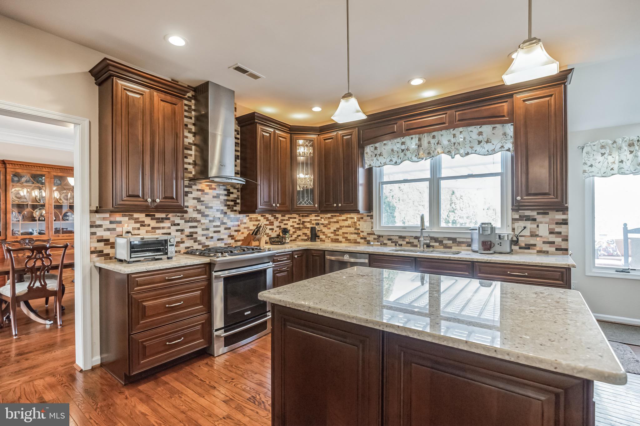 21 Brooks Road Moorestown, NJ 08057 - Photo 7 of 39 a kitchen with stainless steel appliances granite countertop a sink stove and oven