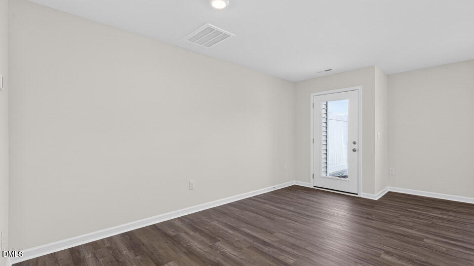 104 Clementine Street Angier, NC 27501 - Photo 11 of 27 a view of an empty room with wooden floor