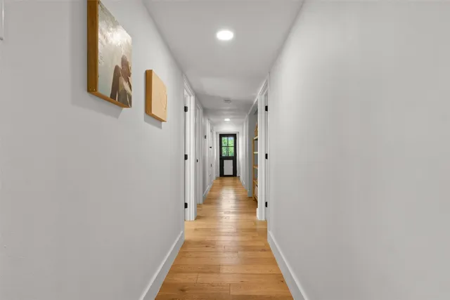 a bathroom with a sink toilet vanity and shower