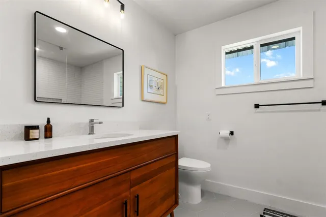 a view of living room with furniture and wooden floor