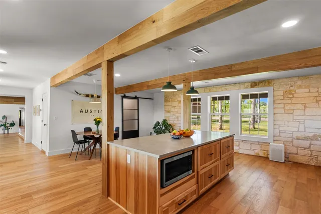 a hall with cabinets and wooden floor