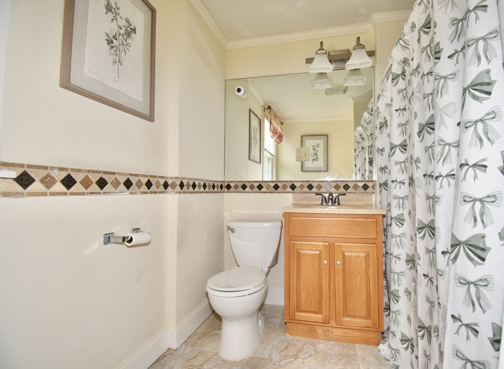 77 Dorset Street Springfield, MA 01108 - Photo 16 of 34 a bathroom with a toilet sink and mirror