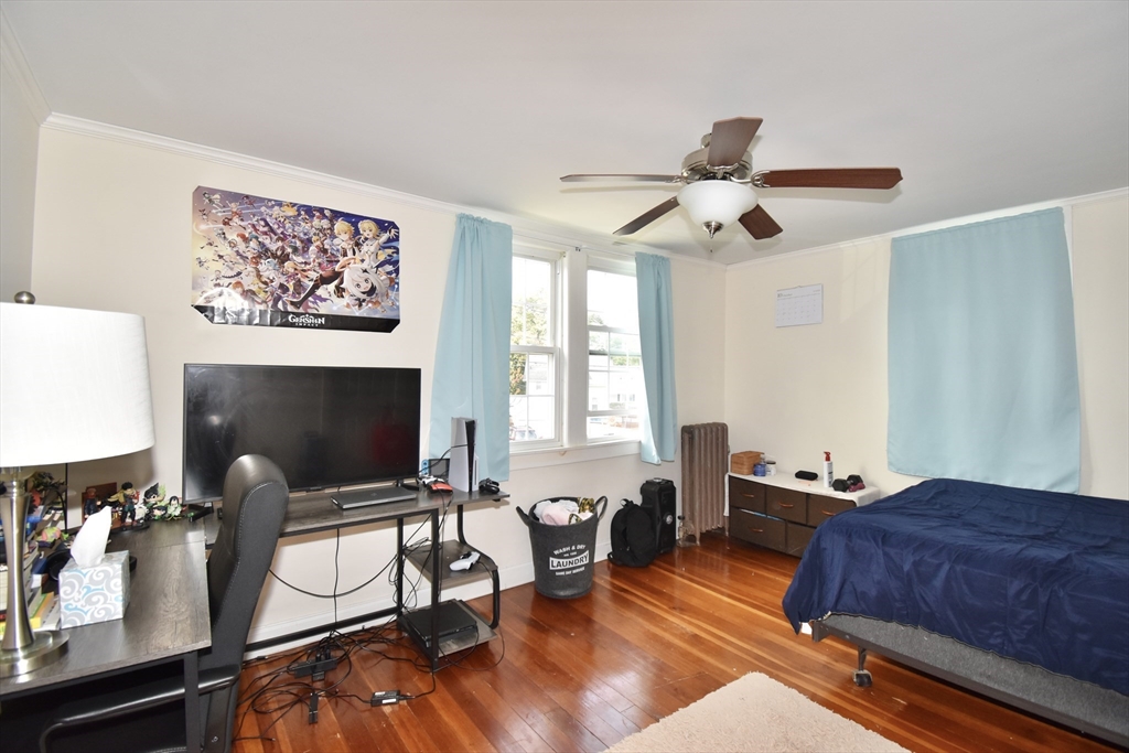 77 Dorset Street Springfield, MA 01108 - Photo 18 of 34 a bedroom with furniture and a window