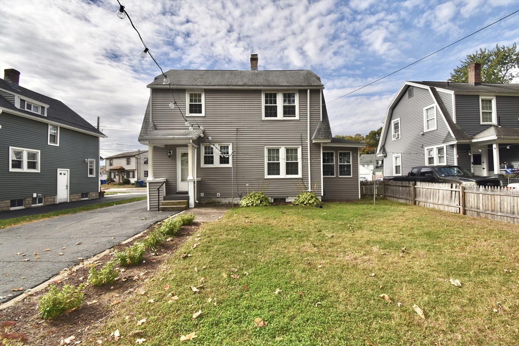 77 Dorset Street Springfield, MA 01108 - Photo 30 of 34 a front view of a house with a yard