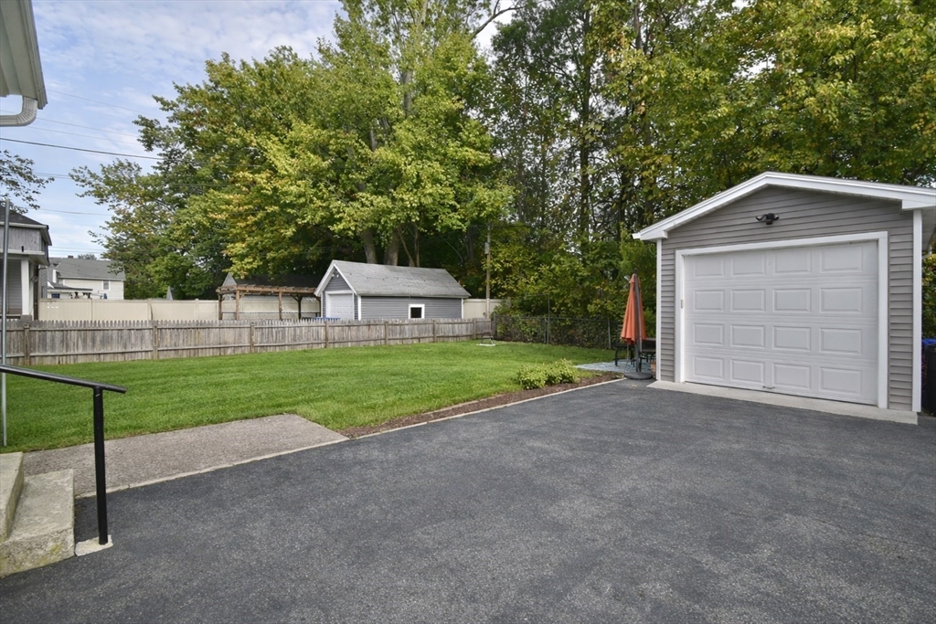 77 Dorset Street Springfield, MA 01108 - Photo 33 of 34 a view of house with backyard and trees