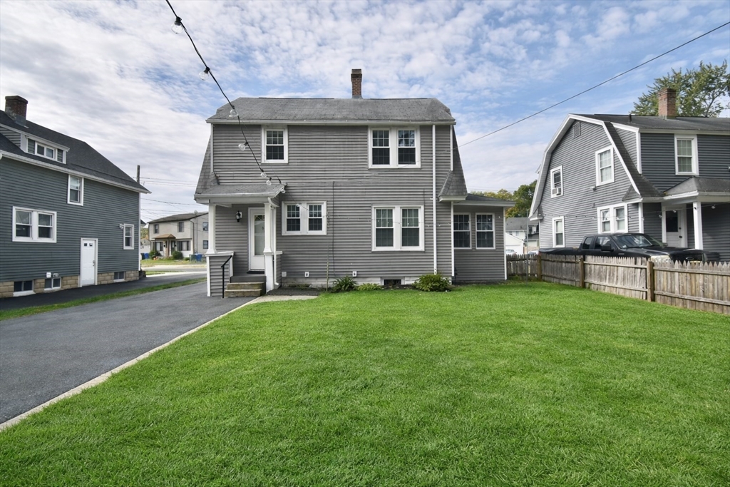 77 Dorset Street Springfield, MA 01108 - Photo 34 of 34 a front view of a house with a yard
