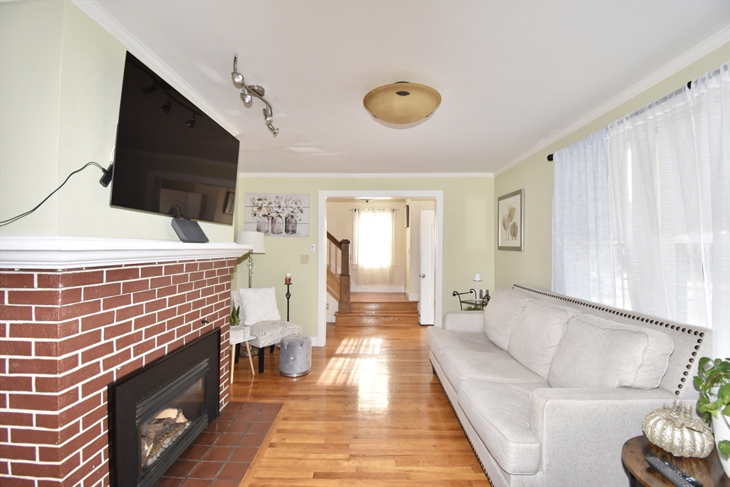 77 Dorset Street Springfield, MA 01108 - Photo 10 of 34 a living room with furniture and a flat screen tv