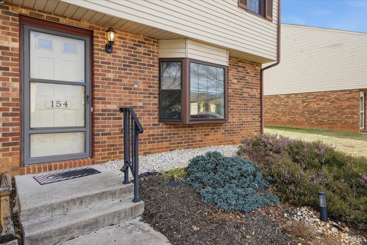 154 Kitty Hawk Square Lynchburg, VA 24502 - Photo 2 of 30 a front view of a house with a yard