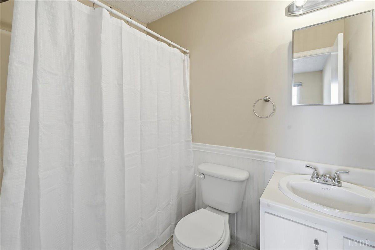 154 Kitty Hawk Square Lynchburg, VA 24502 - Photo 21 of 30 a white toilet sitting next to a bathroom sink