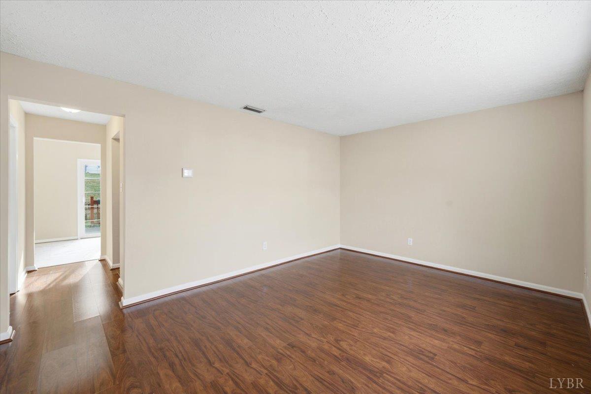 154 Kitty Hawk Square Lynchburg, VA 24502 - Photo 4 of 30 a view of an empty room with wooden floor
