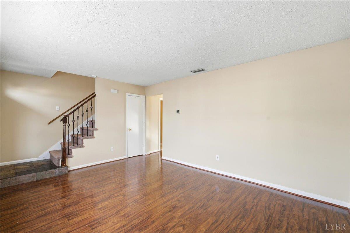 154 Kitty Hawk Square Lynchburg, VA 24502 - Photo 7 of 30 a view of an empty room with wooden floor